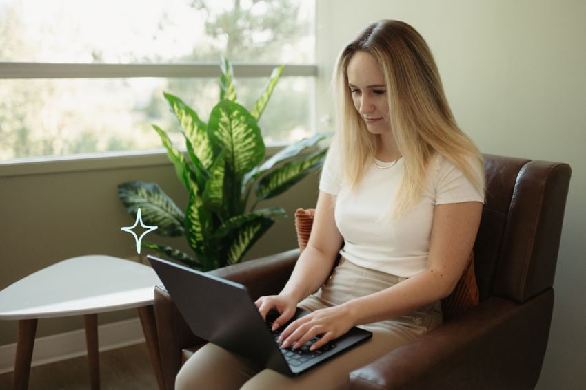 a practitioner seated on her laptop reviewing a therapy cancellation policy