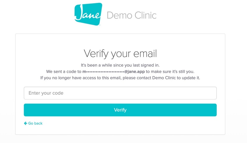 The Verify your email screen showing a masked email address and a field to enter the verification code