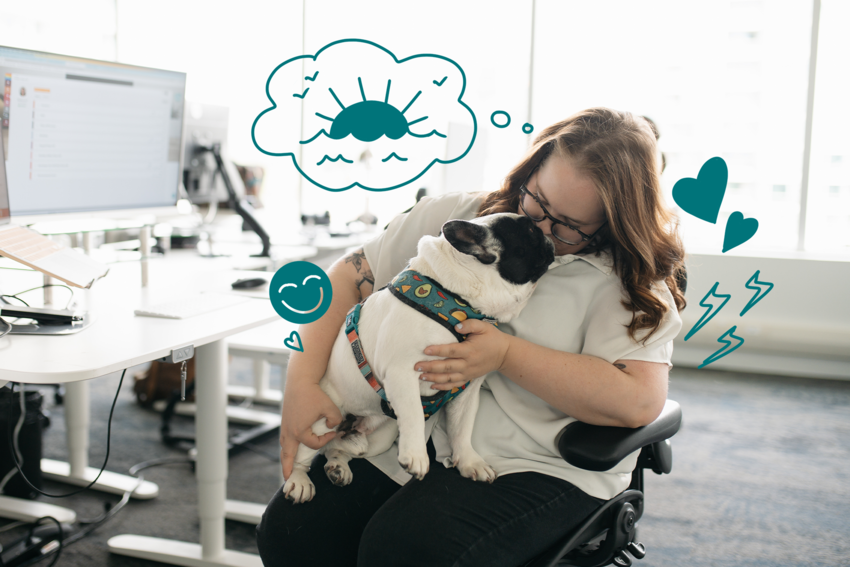 A woman cuddles a French bulldog in her lap in an open-concept office. Illustrated elements of happy faces, hearts, the sun and ocean, and lightning bolts surround her face