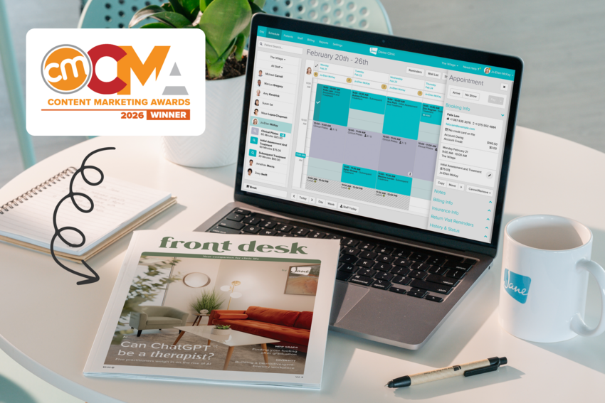 Front Desk magazine on a table next to a laptop showing Jane's schedule, with a 2026 Content Marketing Awards winner badge in the corner