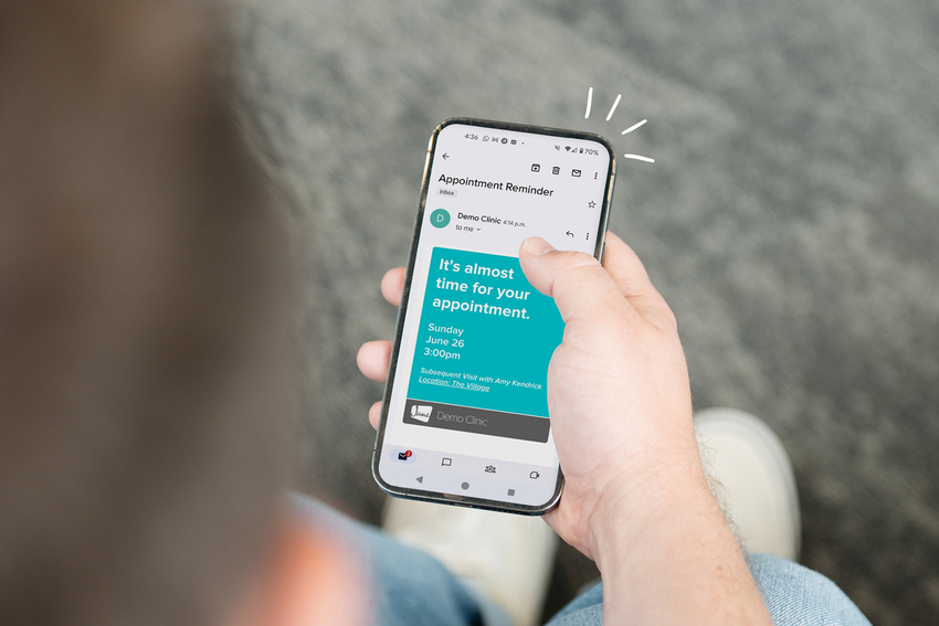 A patient viewing an appointment reminder from Jane on their phone